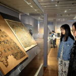 curated by teachers and students, exhibition of asian civilizations on silk roads opens at zhejiang university